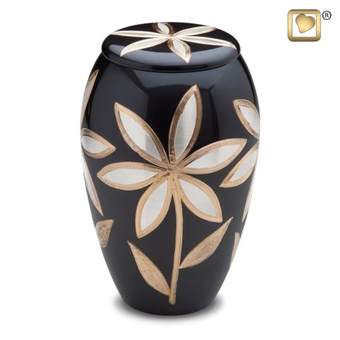 Lilies bloom on the surface of this cremation urn